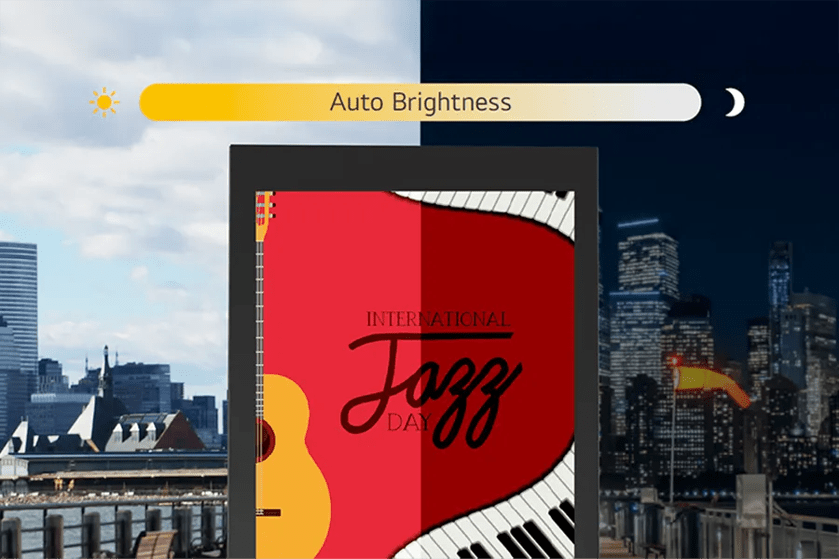 Cityscape with a digital display showing "International Jazz Day" poster and an "Auto Brightness" indicator transitioning from day to night.