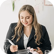Photo of Valentina Rodriquez etching onto a champagne flute.