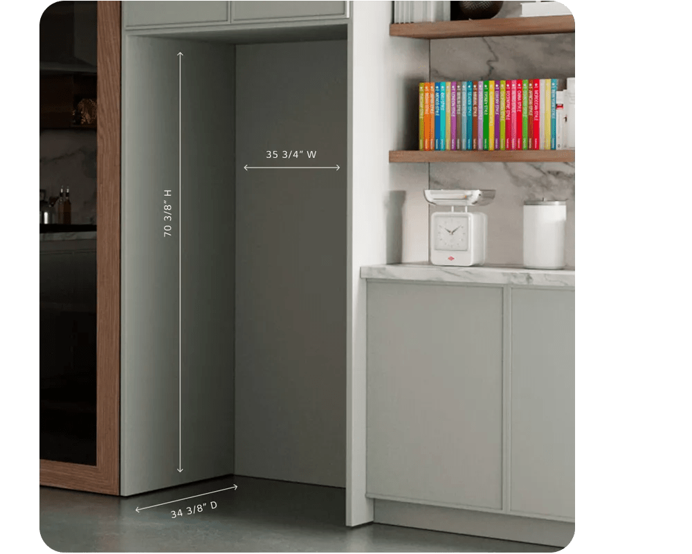 Empty built-in refrigerator alcove with measurements shown: 70 3/8 H, 35 3/4 W, and 34 3/8 D, beside dark cabinetry and pantry area.