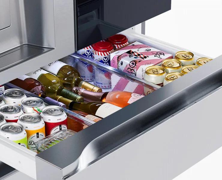 Interactive image showing an open Full-convert Drawer stocked with drinks, snacks, and bottles. The contents change based on the user’s selected temperature setting, updating to display foods and beverages suited for each zone such as chilled wine, deli items, cold drinks, meat or seafood, or frozen goods.