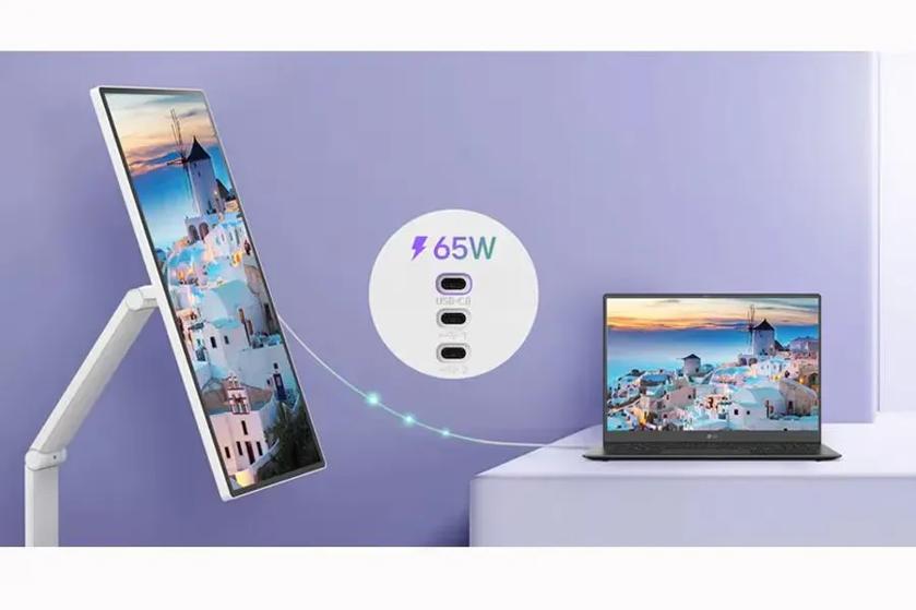 Monitor and laptop displaying the same scenic image with USB-C charging capability.