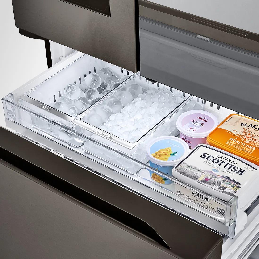 Close-up of an LG refrigerator freezer drawer with Craft Ice, crushed ice and neatly organized frozen items like ice cream and packaged foods.