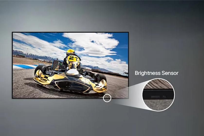 65UL5Q-M UHD Signage showing an image of a racecar. A pop-out circle shows a close up image of the brightness sensor on the display, and is labeled Brightness Sensor.