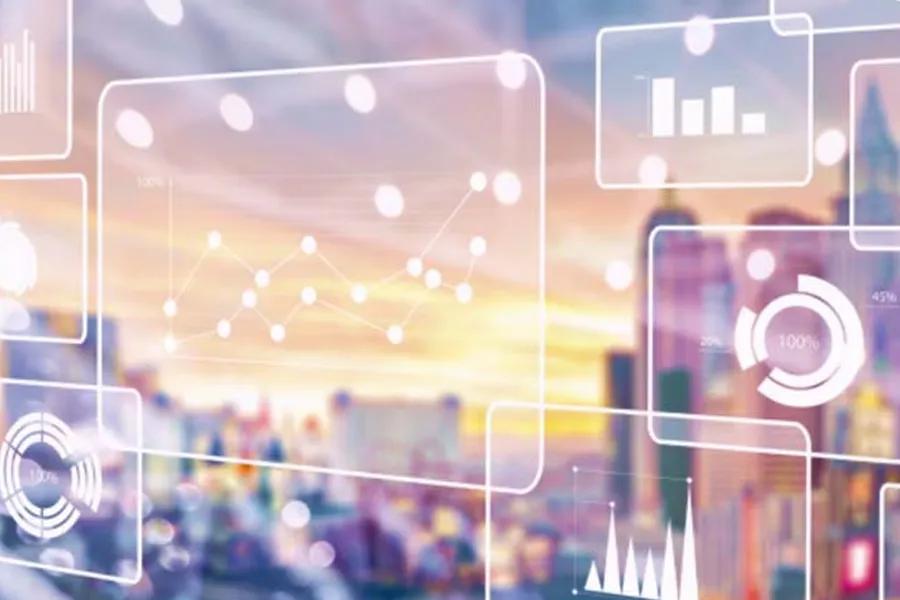 Digital charts and graphs overlaid on a blurred cityscape at sunset.
