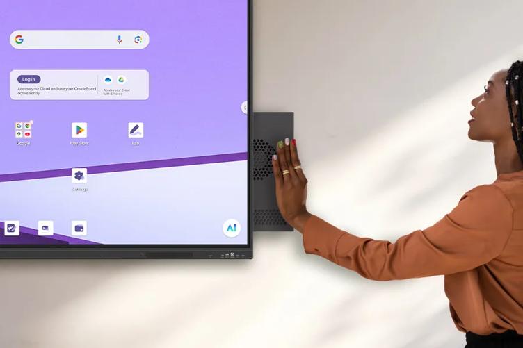 A teacher inserts an OPS slot-in device into an LG CreateBoard