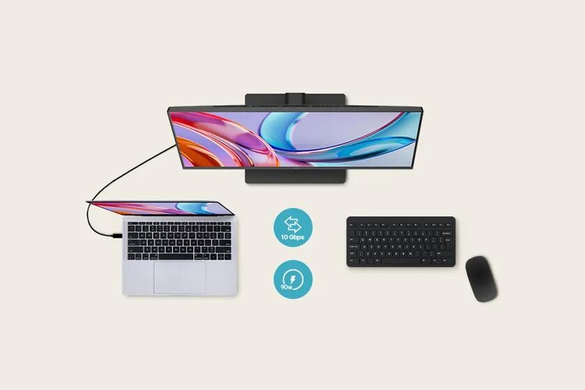 Top view of a monitor connected to a laptop, with a keyboard and mouse placed below.