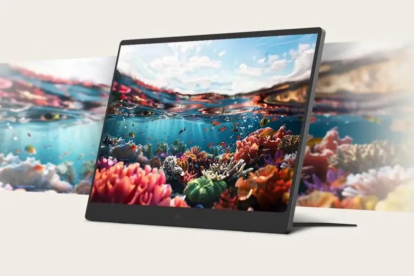 A computer monitor displaying a vivid underwater coral reef scene.