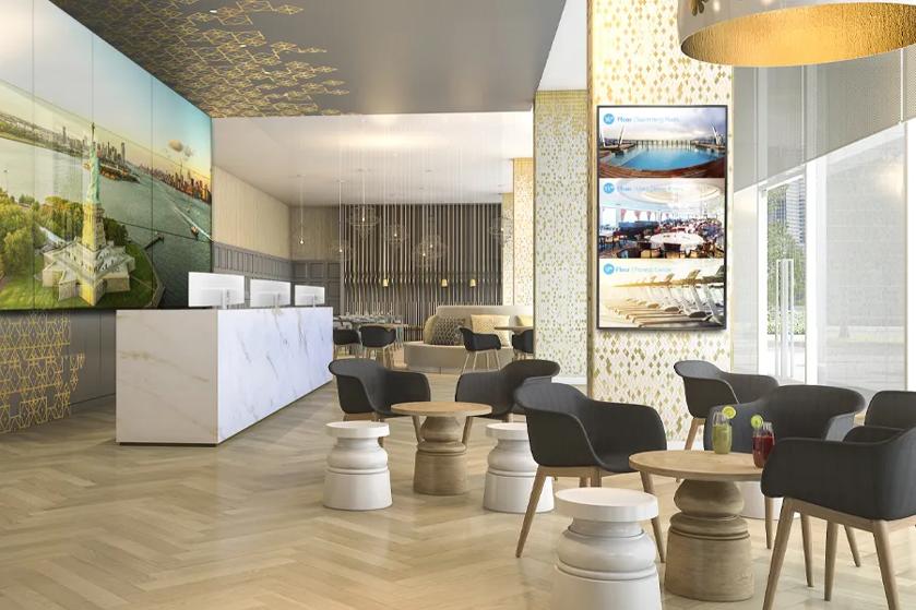 An elegant cruise ship common area with dazzling LG video wall and wayfinding signage.