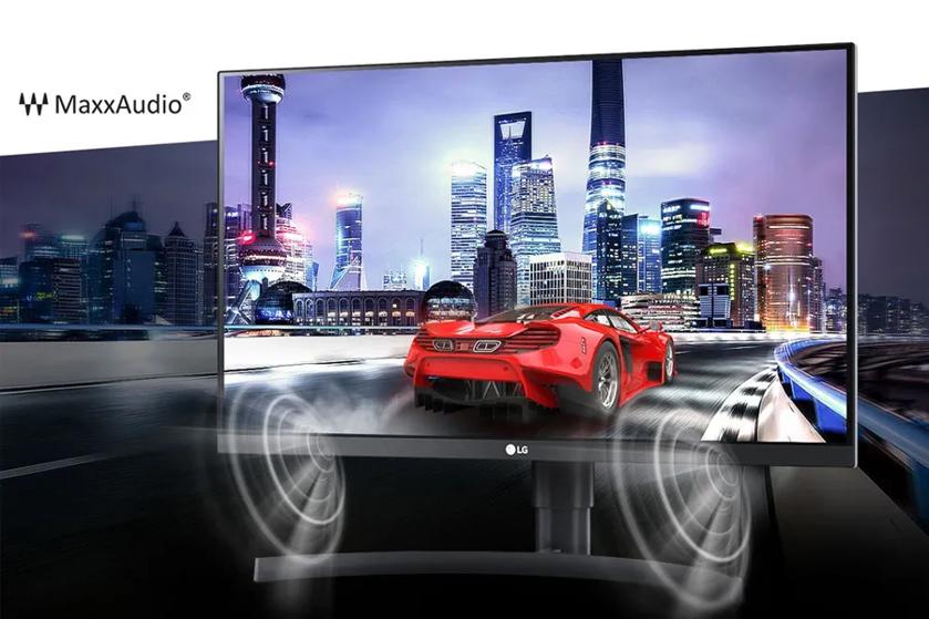 A gaming setup with an LG monitor showing a red sports car driving in a brightly lit cityscape, with HDR and MaxxAudio logos.