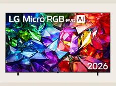 The front view of LG Micro RGB evo AI MRGB95, released in 2026, features a slim black bezel on low-profile feet, with a vivid, crystalline image of sharply defined red, green, and blue facets filling the screen.