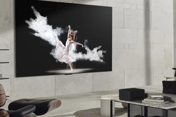 Wall-mounted wireless TV in a living room.