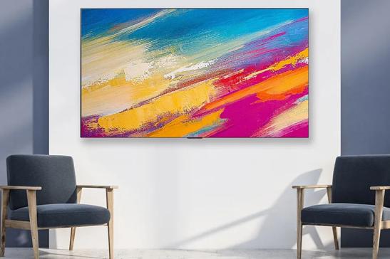 Hotel room with a wall-mounted TV displaying colorful hot air balloons