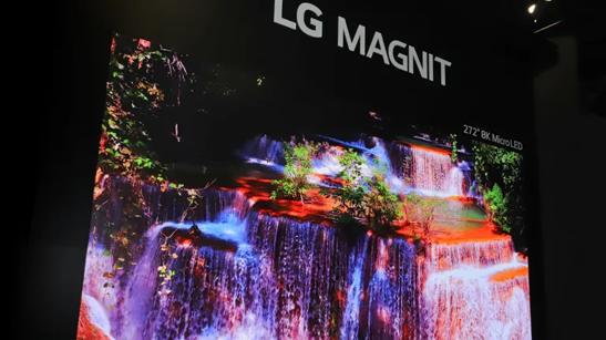A close-up view of an LG commercial MAGNIT display, showing a waterfall surrounded with vividly colored foliage. 