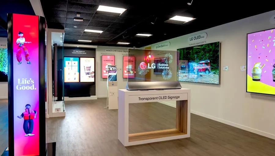 Guests using an LG touch kiosk's interactive display.