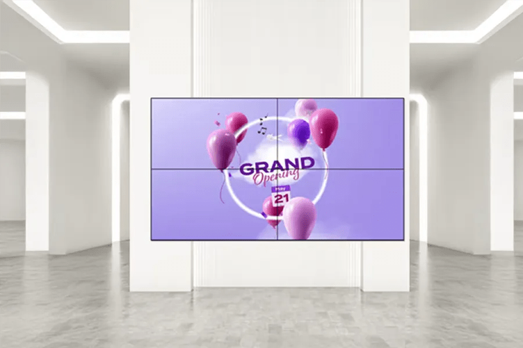A video wall in a modern room displays a "GRAND Opening" announcement with pink and purple balloons against a purple background.