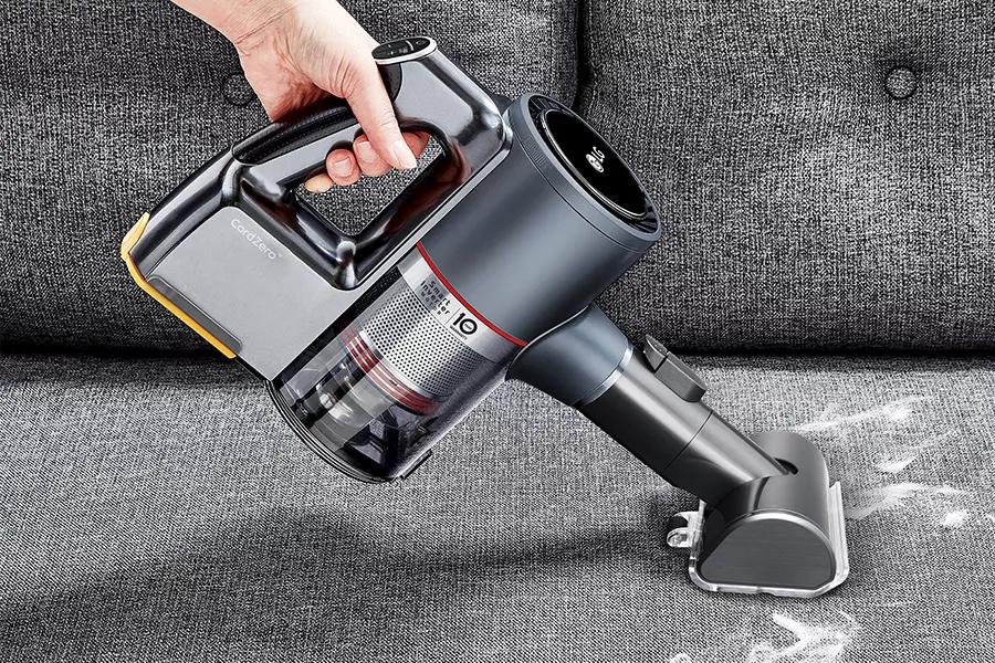 LG CordZeroTM transforming into handheld vacuum with Power Punch nozzle to vacuum couch