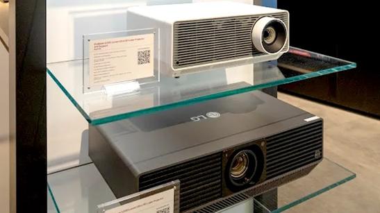 A close-up photograph of two ProBeam Projectors in a glass display case.