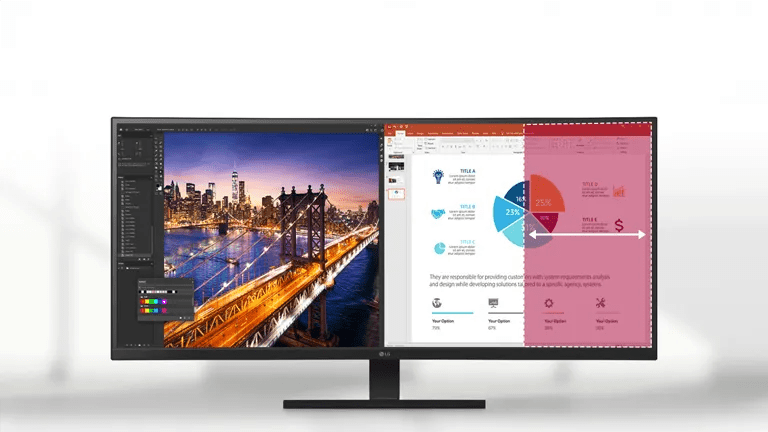 Widescreen monitor displaying cityscape photo editing and a presentation slide with a pie chart.