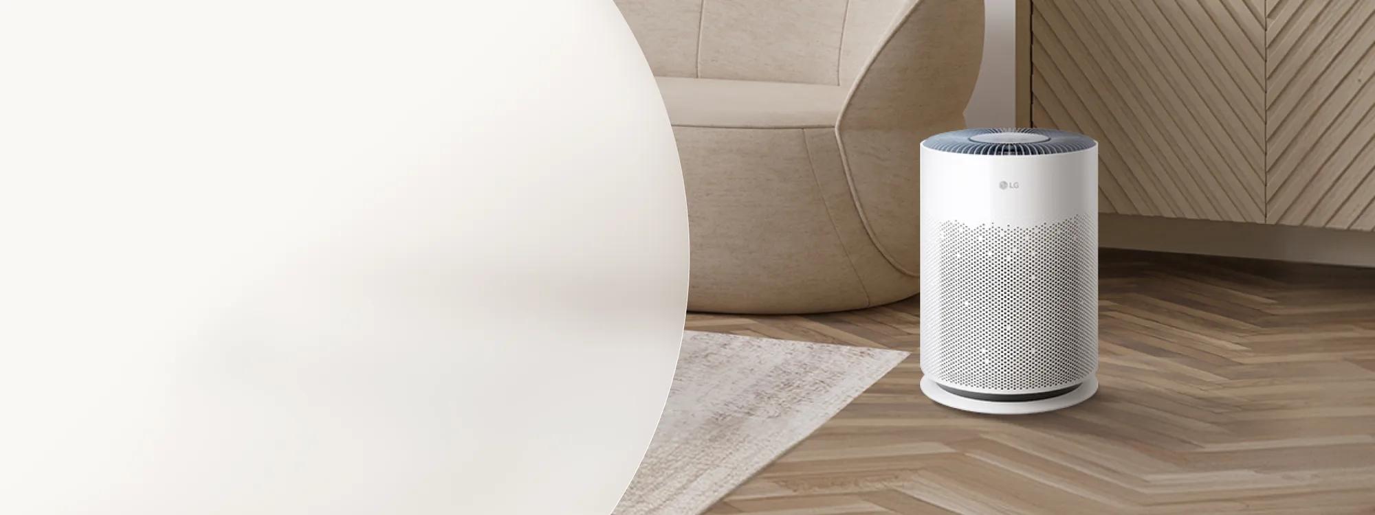 Labor Day LG air purifier savings promotion featuring a white cylindrical LG air purifier on a herringbone wood floor beside a rounded beige chair and textured wall panel