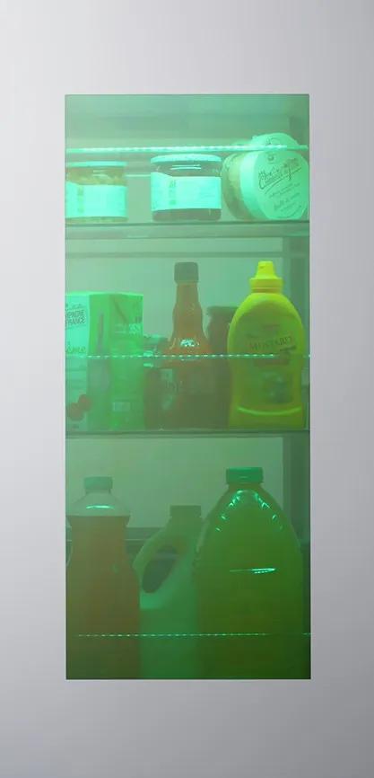 Interactive feature showing an InstaView panel on the left and a color-selection interface on the right. Users can choose from five LED lighting options: Emerald Green, Sapphire Blue, Amethyst Purple, Ruby Red, or Citrine Orange. When a color is selected, the name of that hue appears and the InstaView window reveals the inside of the fridge illuminated in that chosen color.