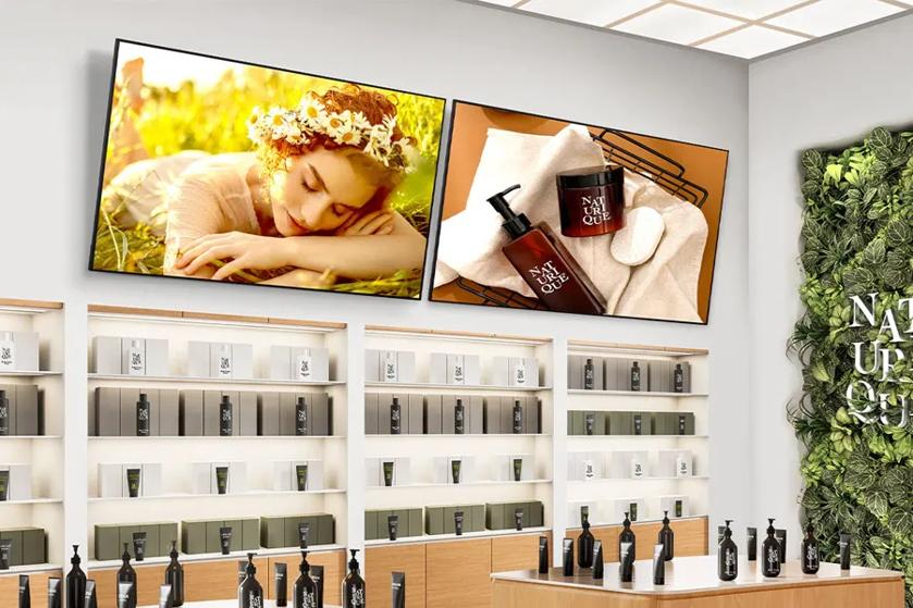 Two 65UL5Q-M UHD Signage displays in a health and beauty store