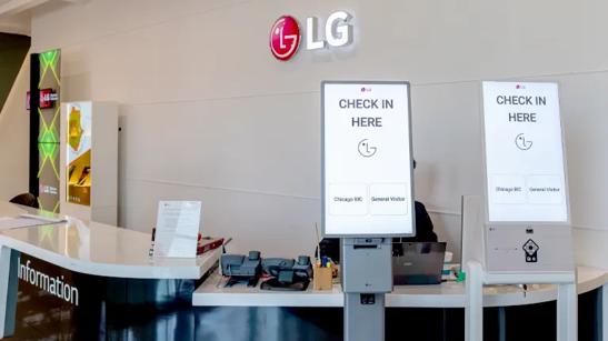 LG digital touch kiosks greet visitors at the reception desk of the Chicago Business Innovation Center