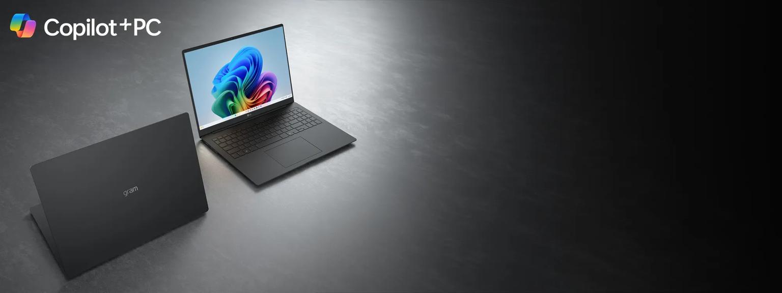 Two dark gray LG gram laptops on a metallic gray surface, one open facing forward with a colorful swirl display and one angled showing the back. The Microsoft Copilot logo is in the top left corner.