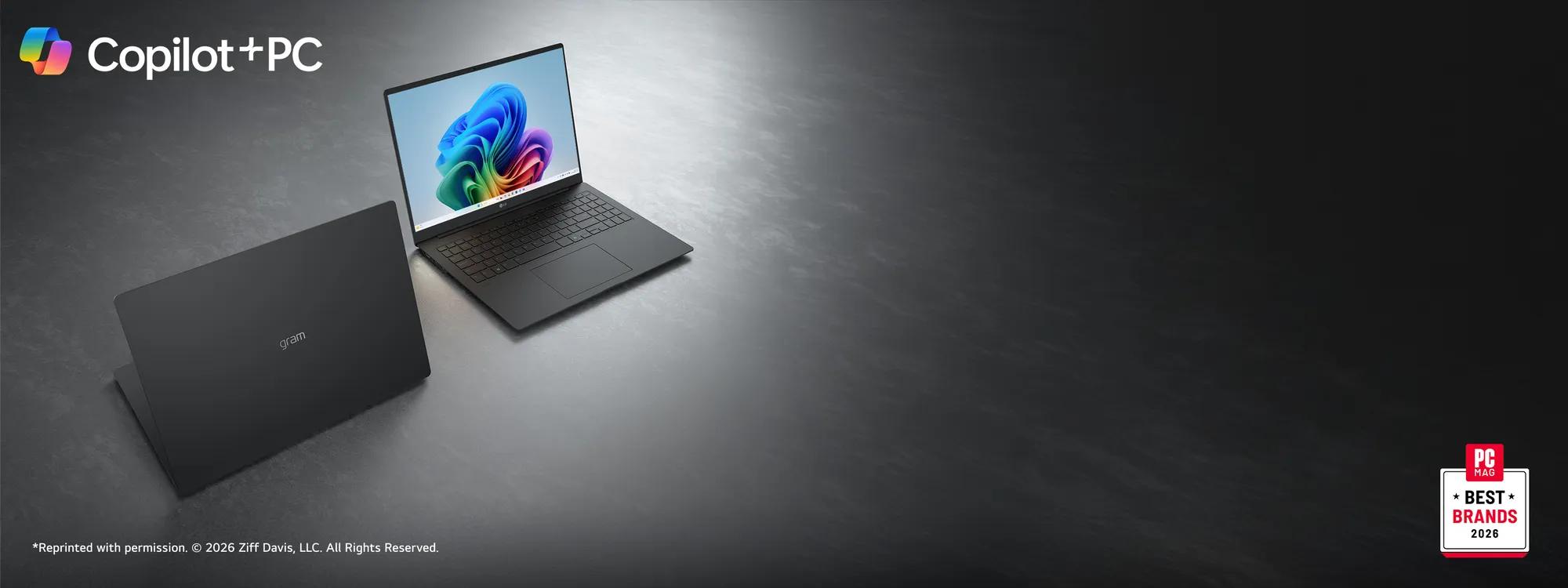 Two dark gray LG gram laptops on a metallic gray surface, one open facing forward with a colorful swirl display and one angled showing the back. The Microsoft Copilot logo is in the top left corner. “PC Mag Best Brands 2026” badge.