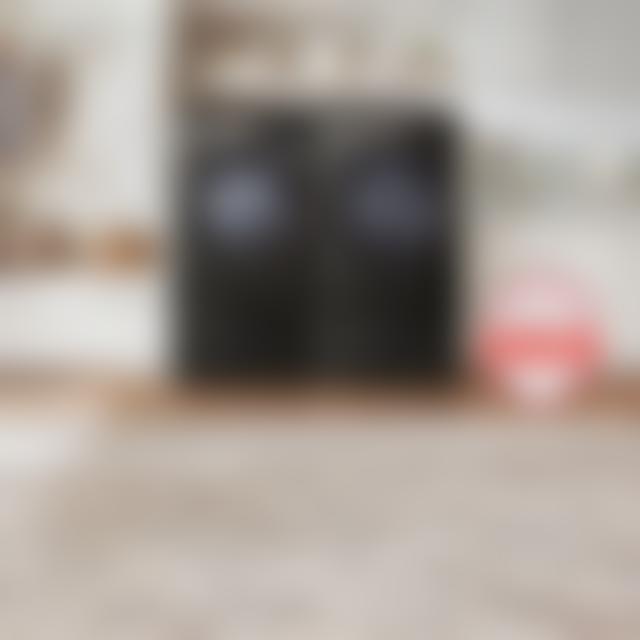 LG front-load washer and dryer set on pedestals in a laundry room, with Brought to You by America's Most Reliable Line of Appliances badge.