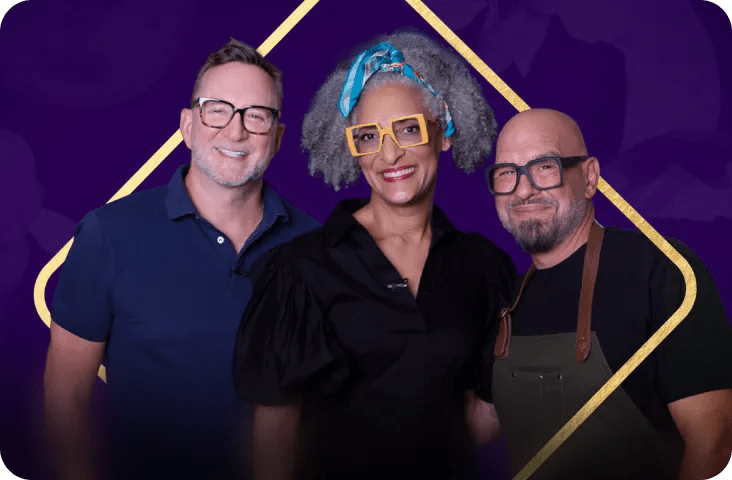 'All Chewed Up' show hosts Clinton Kelly, Carla Hall and Michael Symon smiling and facing the cameras.