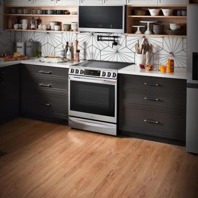 An LG Cooktop and over-the-range-microwave appear in a bright kitchen setting.