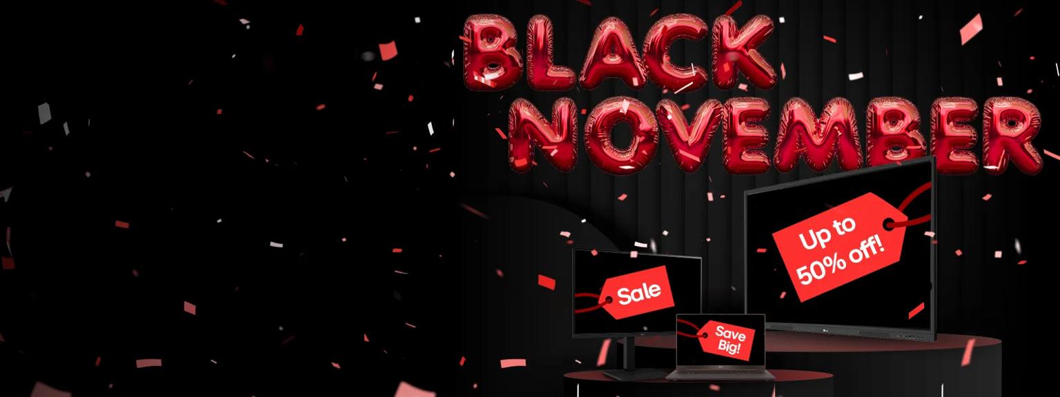 Red balloons shaped like letters spell out 'Black November' on a dark background. Beneath them is an LG CreateBoard, monitor, and gram laptop, with red sales tags on their screens. The tags read Save Big, Sale, and Up to 50% off! Confetti falls around the scene.