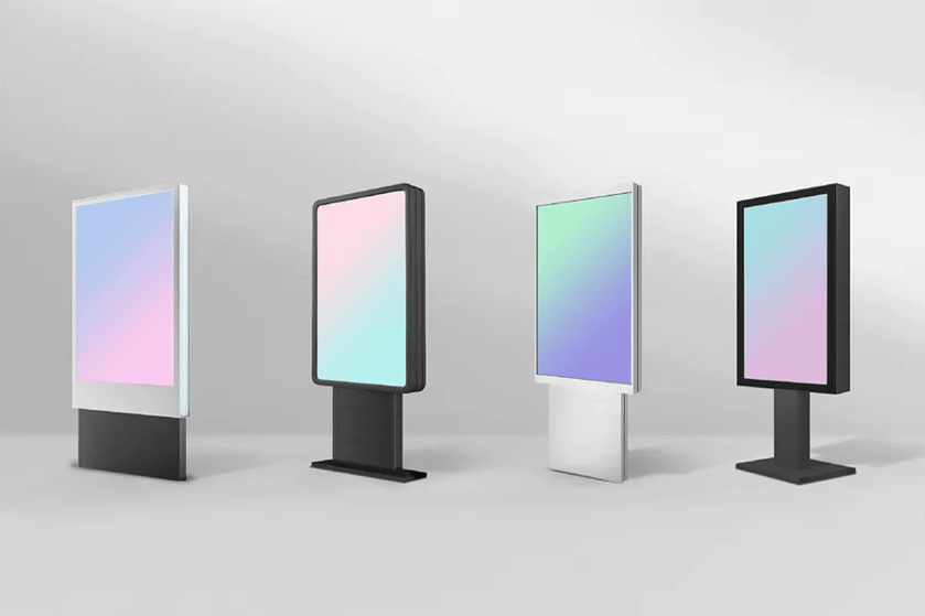 Four freestanding digital displays with gradient screens in various colors and frames.