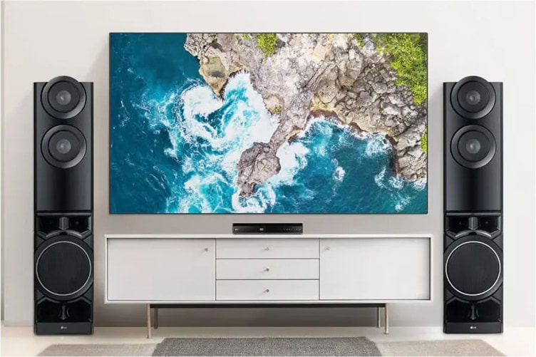 an entertainment center with a top-view image of the ocean on the TV screen