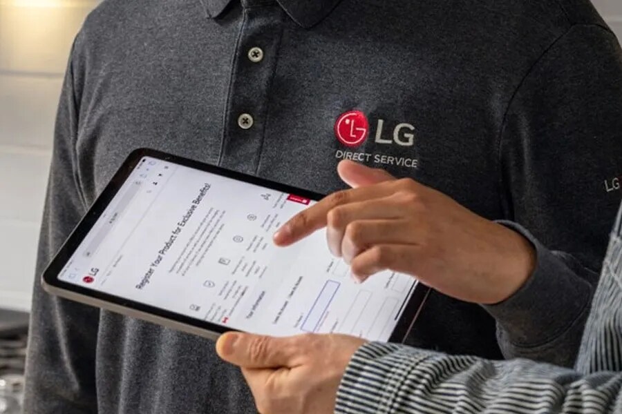 LG technicians with a tablet 