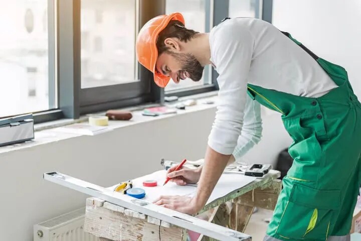 contractor working on building plans