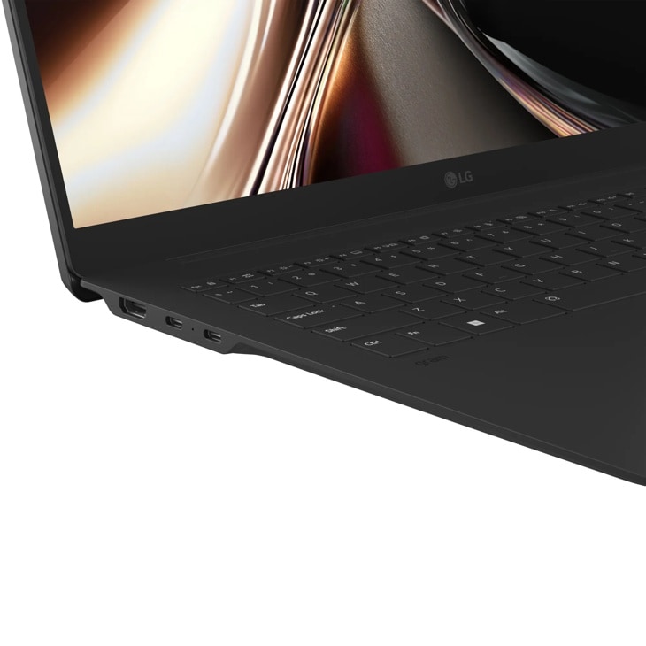 LG Gram 17Z90U-H_AU89U1 Laptop showing keyboard and side ports with vibrant display screen - Side Angle