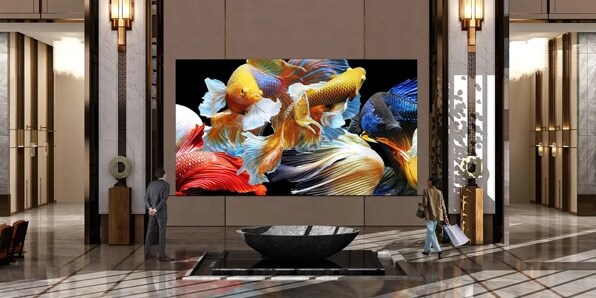 Hotel lobby with a large display of colorful fish.