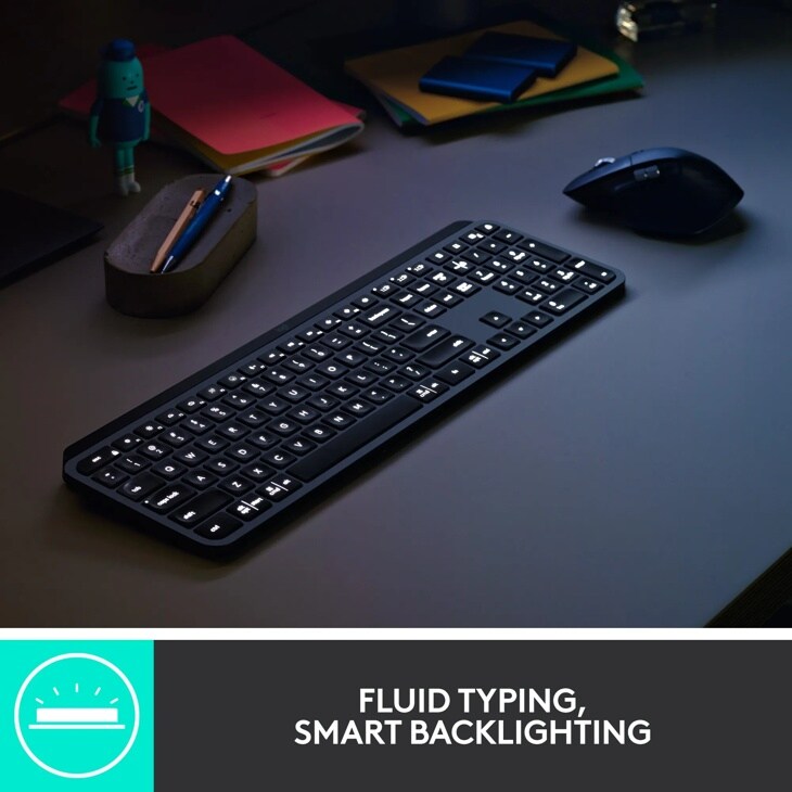 Logitech 920010923 wireless keyboard with illuminated backlit keys on desk with mouse and office supplies - FLUID TYPING, SMART BACKLIGHTING