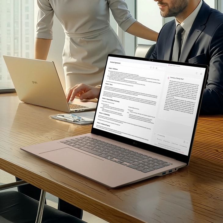 LG Gram 17Z90UR-P.AU99U3 Laptop displaying contract document on screen in office setting with second laptop on wooden desk