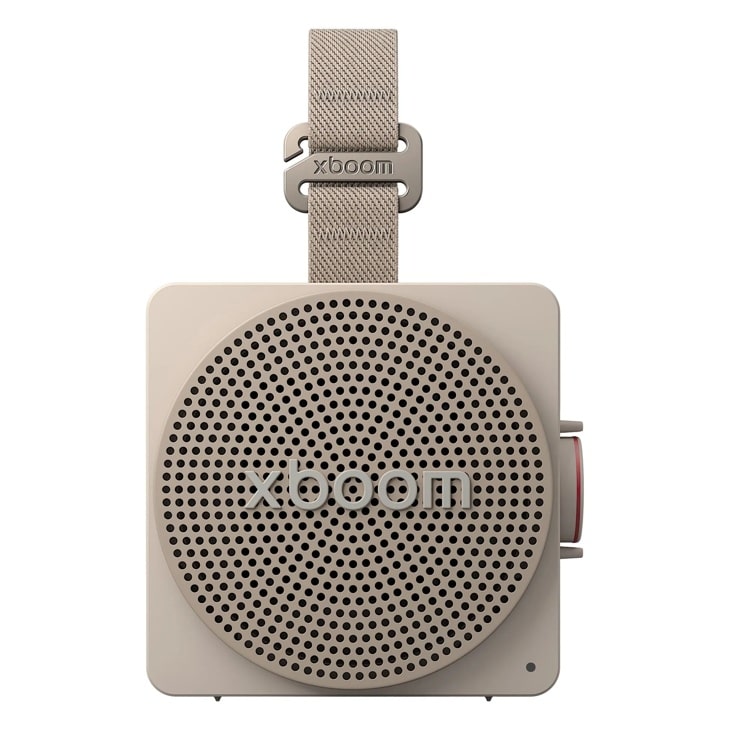 LG xboom MINI_ANOALWG portable speaker with beige fabric strap, square design, circular speaker grille, and side button