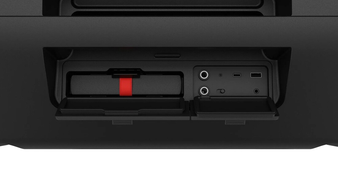 STAGE501_AUSALBK Party Speaker connection panel showing audio ports, USB port, and storage compartment with red pull tab - Close-Up
