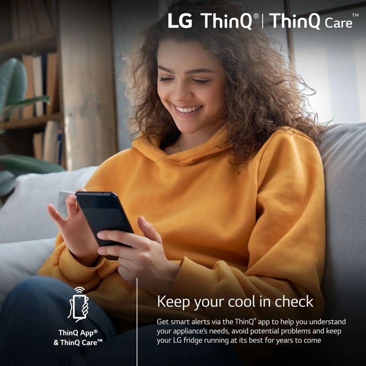 Person holding a phone with LG ThinQ and ThinQ Care message about smart alerts