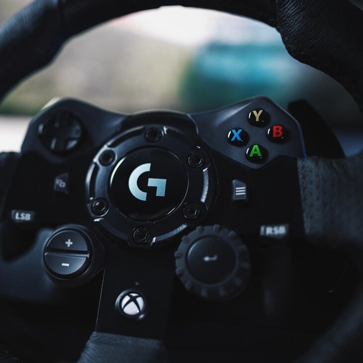 Logitech 941000147 gaming racing wheel with G logo center and colorful X Y A B buttons - Close-Up