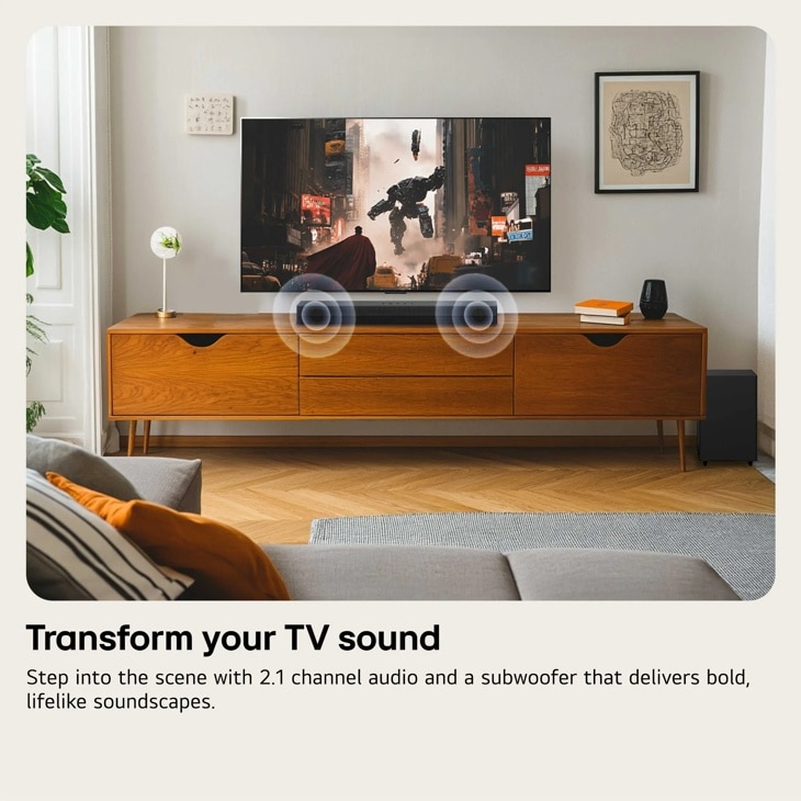 S35A Soundbar with subwoofer in modern living room setup showing sound waves emanating from TV displaying action scene - Lifestyle View