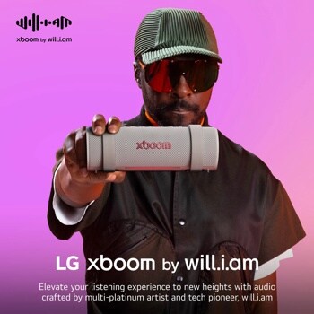 Image of will.i.am holding the xboom Grab in Warm Grey