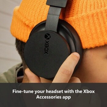 Xbox TLL00020 wireless headset with black ear cup showing Xbox logo being held by hand with text Fine-tune your headset with the Xbox Accessories app