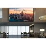 Modern interior with a large cityscape display and elegant furnishings.