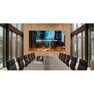 Modern conference room with a large screen displaying "Smart City Master Plan" and urban scene.