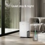 LG DT501BWR0 Dehumidifier infographic showing quiet 40 dB operation in modern living room with large windows